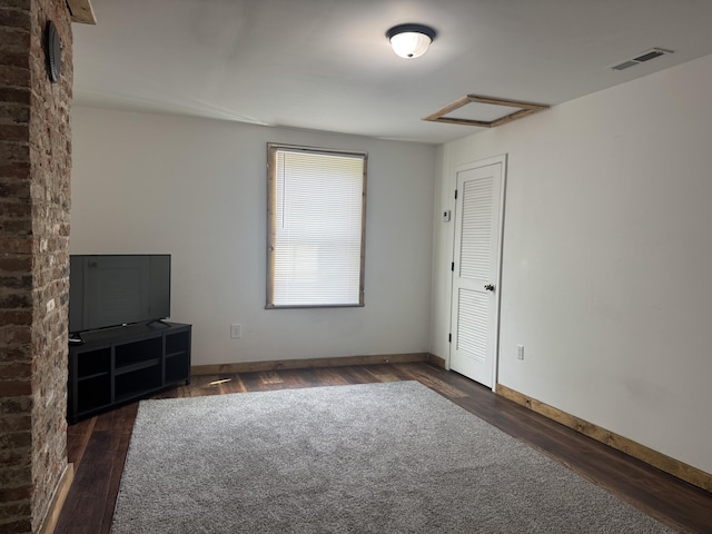 104 First St, Cynthiana, KY 41031 - empty room featuring attic access, wood finished floors, and baseboards