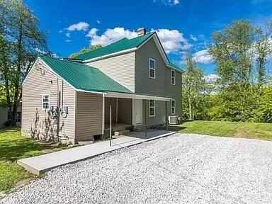 104 First St, Cynthiana, KY 41031 - back of house featuring a yard