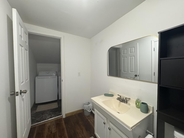 104 First St, Cynthiana, KY 41031 - half bathroom featuring wood finished floors, vanity, baseboards, toilet, and washing machine and clothes dryer