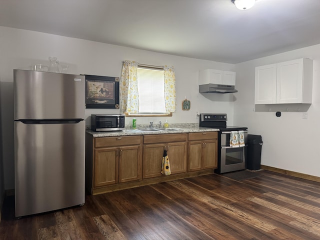 104 First St, Cynthiana, KY 41031 - kitchen featuring stainless steel appliances, brown cabinetry, dark wood-style floors, and a sink