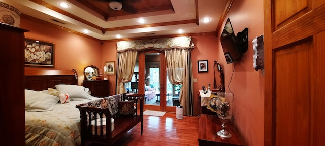 2619 County Farm Rd, London, KY 40741 - bedroom featuring recessed lighting, ornamental molding, a tray ceiling, and wood finished floors