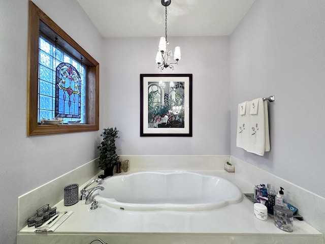2619 County Farm Rd, London, KY 40741 - bathroom featuring a notable chandelier and a bath