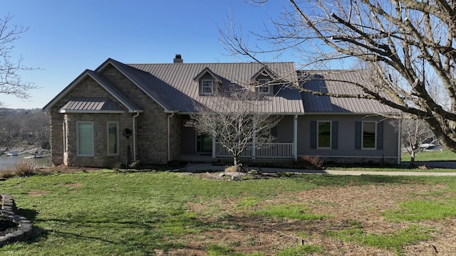 1794 Hunter Dr, Lancaster, KY 40444 - view of front of house with covered porch, a chimney, a front lawn, and metal roof