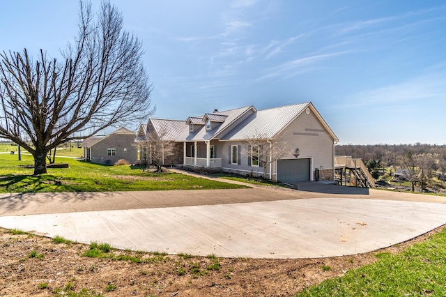 1794 Hunter Dr, Lancaster, KY 40444 - back of house featuring driveway, metal roof, and a lawn