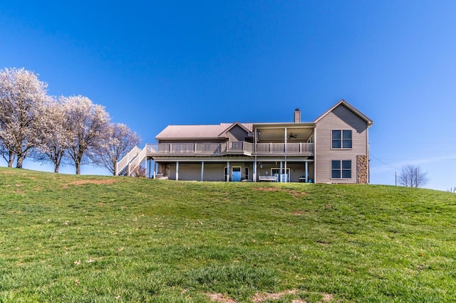 1794 Hunter Dr, Lancaster, KY 40444 - rear view of property with a ceiling fan, a chimney, a lawn, and a deck