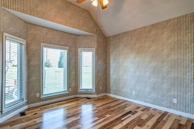 1794 Hunter Dr, Lancaster, KY 40444 - unfurnished room with vaulted ceiling, wood finished floors, a ceiling fan, healthy amount of natural light, and baseboards