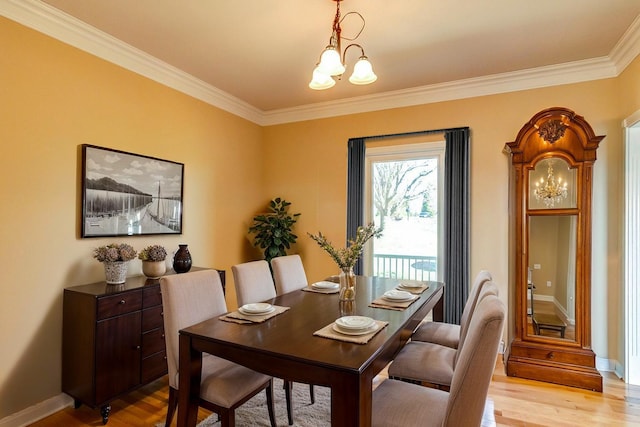 1794 Hunter Dr, Lancaster, KY 40444 - dining room with a chandelier, light wood finished floors, crown molding, and baseboards