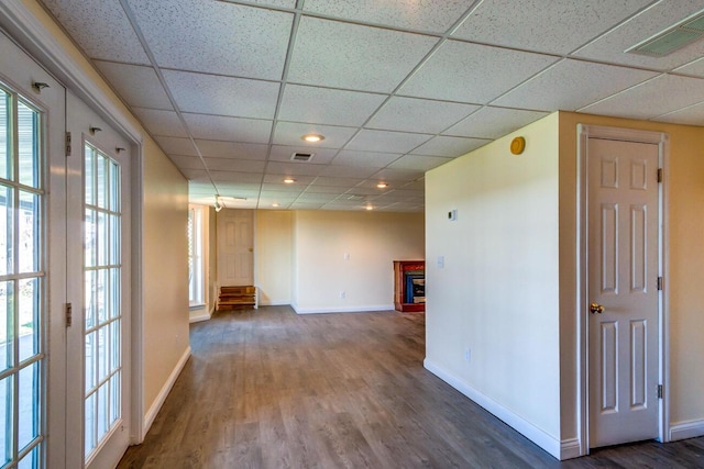 1794 Hunter Dr, Lancaster, KY 40444 - empty room featuring a paneled ceiling, baseboards, wood finished floors, and a fireplace