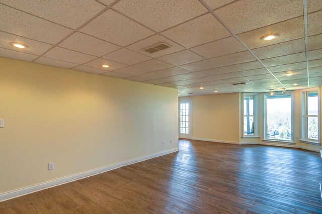 1794 Hunter Dr, Lancaster, KY 40444 - spare room featuring baseboards, wood finished floors, and a paneled ceiling
