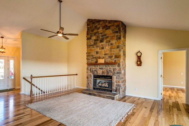 1794 Hunter Dr, Lancaster, KY 40444 - living room with wood finished floors, ceiling fan, a fireplace, baseboards, and high vaulted ceiling