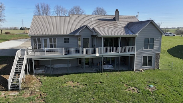 1794 Hunter Dr, Lancaster, KY 40444 - rear view of house with stairway, metal roof, a yard, and a wooden deck