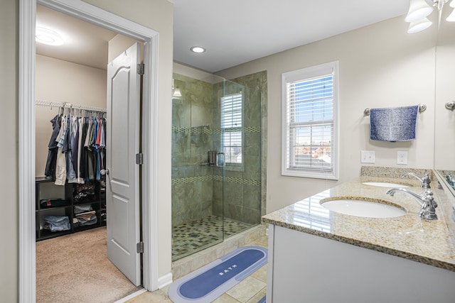 205 Hedgewood Ln, Richmond, KY 40475 - full bathroom with a spacious closet, double vanity, a sink, and a shower stall
