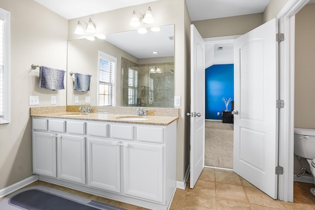 205 Hedgewood Ln, Richmond, KY 40475 - bathroom featuring a shower stall, double vanity, toilet, and a sink