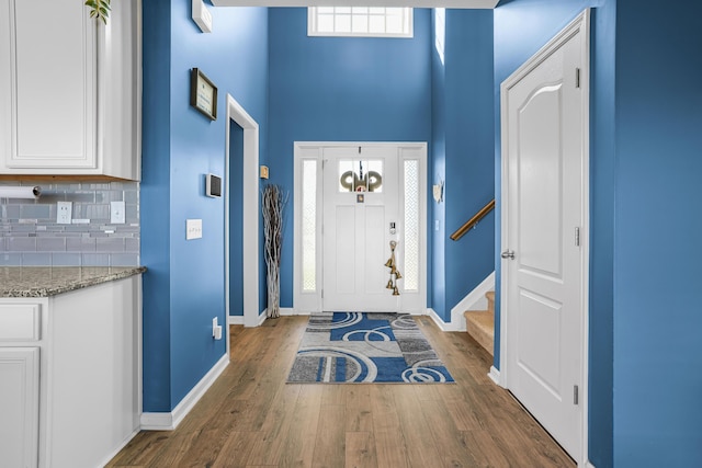205 Hedgewood Ln, Richmond, KY 40475 - foyer featuring a high ceiling, baseboards, stairs, and wood finished floors