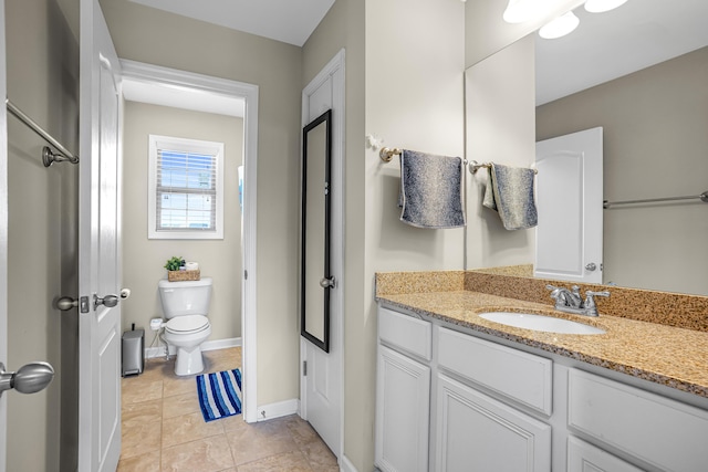 205 Hedgewood Ln, Richmond, KY 40475 - bathroom with toilet, vanity, tile patterned floors, and baseboards