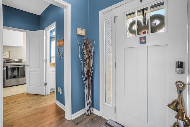 205 Hedgewood Ln, Richmond, KY 40475 - foyer featuring baseboards, light wood-type flooring, and washer / dryer