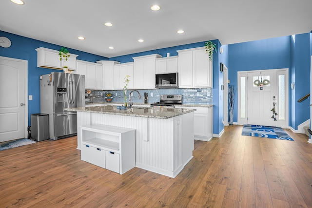 205 Hedgewood Ln, Richmond, KY 40475 - kitchen featuring white cabinetry, light stone countertops, and appliances with stainless steel finishes