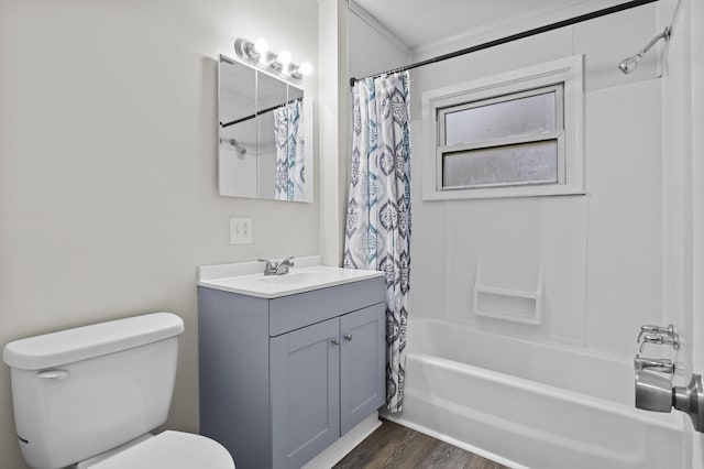 bathroom with toilet, shower / bath combo, wood finished floors, and vanity