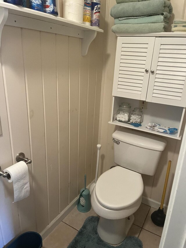 bathroom with tile patterned floors and toilet