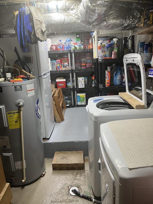 clothes washing area with water heater and laundry area