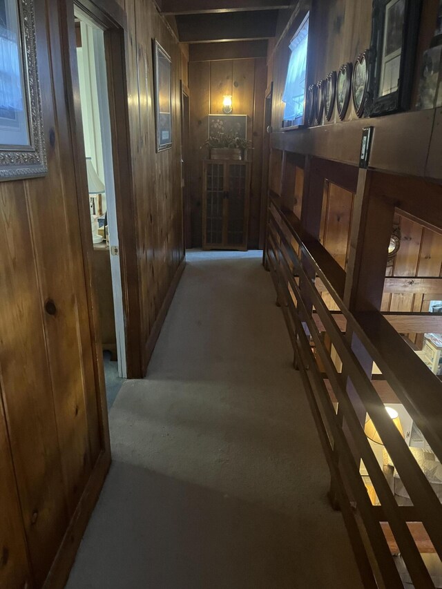 hallway featuring wooden walls