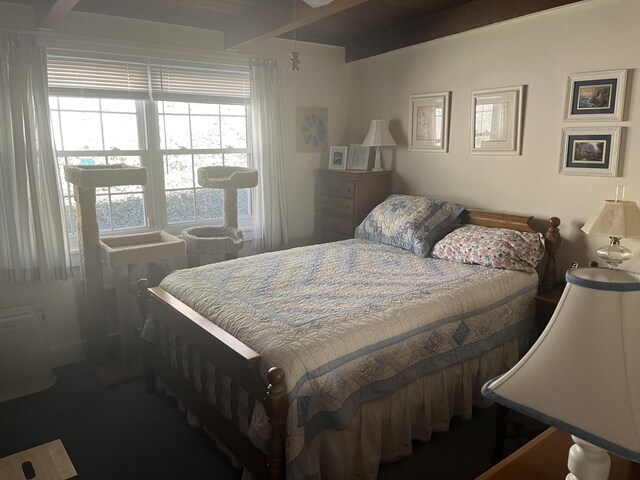 bedroom featuring beam ceiling