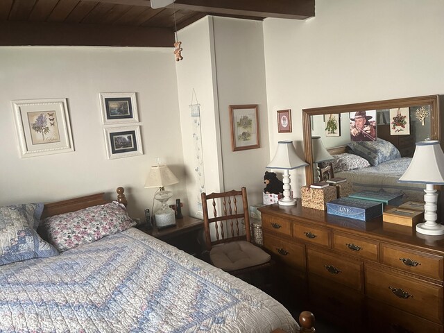 bedroom with beam ceiling and wooden ceiling