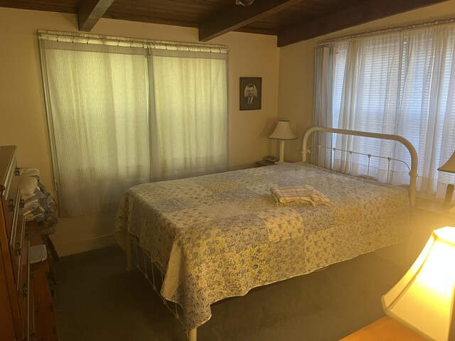 bedroom featuring beam ceiling