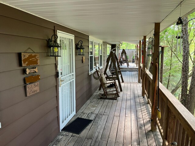 wooden terrace with a porch