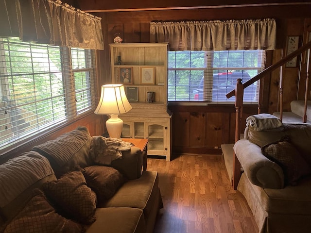907 Augusta Dr, Cumberland, KY 40823 - living area featuring wood walls and light wood finished floors