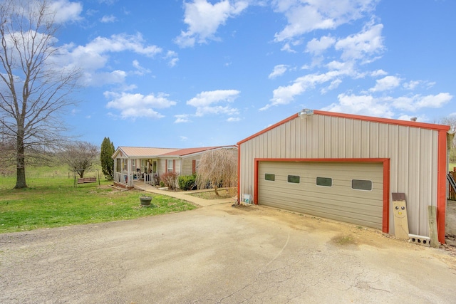 360 N Middletown Rd, Winchester, KY 40391 - view of front of property featuring a front yard, an outdoor structure, a porch, and a detached garage