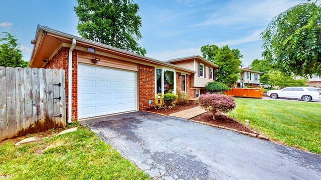 3485 Twillingate Ct, Lexington, KY 40503 - tri-level home featuring brick siding, a garage, and asphalt driveway