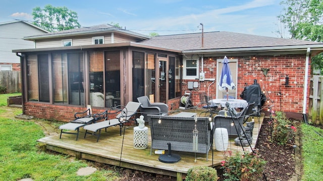 3485 Twillingate Ct, Lexington, KY 40503 - rear view of property featuring a sunroom, brick siding, a deck, and roof with shingles