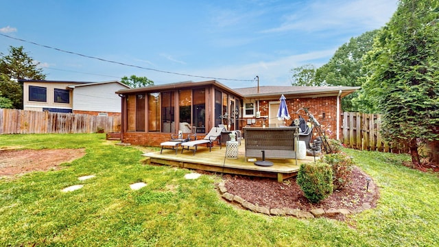 3485 Twillingate Ct, Lexington, KY 40503 - back of property with a sunroom, brick siding, a fenced backyard, and a deck