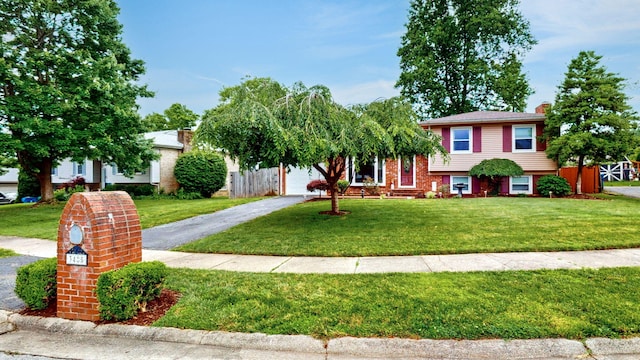 3485 Twillingate Ct, Lexington, KY 40503 - view of front of home with asphalt driveway, a front lawn, and a chimney