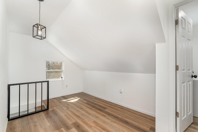 104 W 1st St, Silver Grove, KY 41085 - bonus room with baseboards, lofted ceiling, and wood finished floors