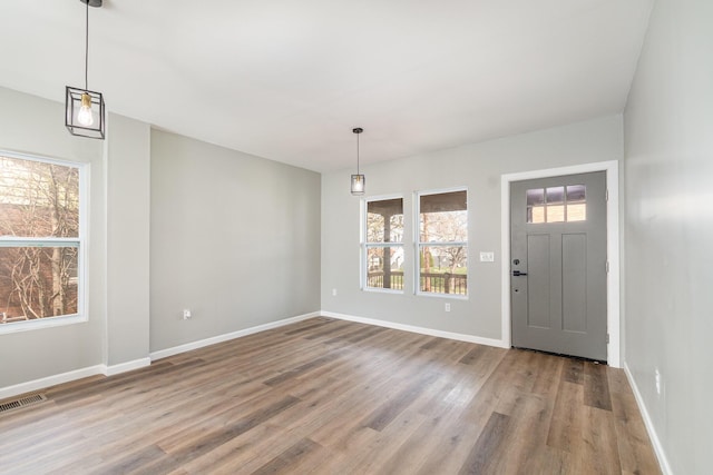 104 W 1st St, Silver Grove, KY 41085 - entrance foyer with baseboards, visible vents, and wood finished floors
