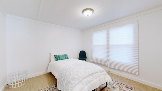 bedroom with baseboards and carpet flooring