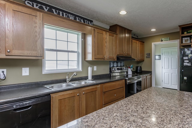 kitchen featuring a sink, a textured ceiling, brown cabinets, under cabinet range hood, and black appliances