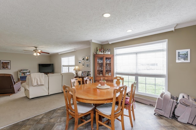 dining space featuring crown molding, a textured ceiling, and ceiling fan