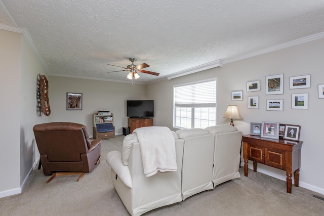 living area featuring light colored carpet, crown molding, ceiling fan, and baseboards