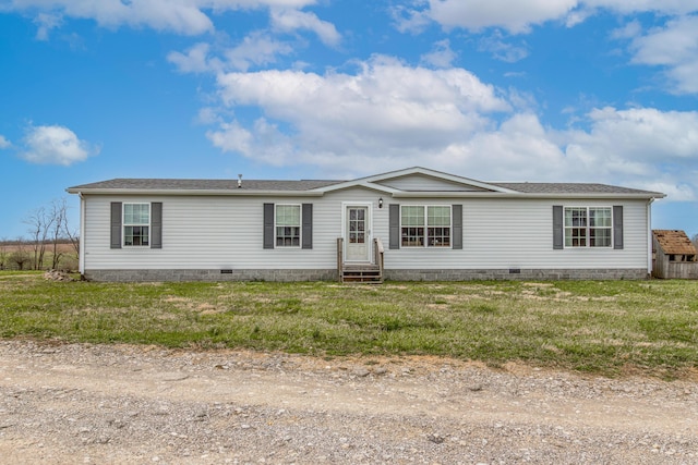 manufactured / mobile home featuring crawl space and a front yard