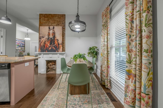 dining space featuring dark wood-style flooring and visible vents