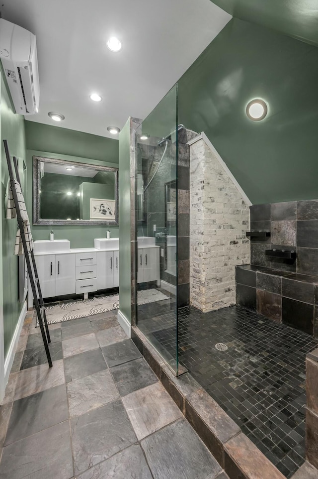 bathroom with a walk in shower, recessed lighting, an AC wall unit, lofted ceiling, and double vanity