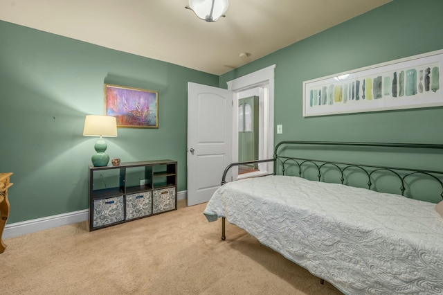 carpeted bedroom with baseboards