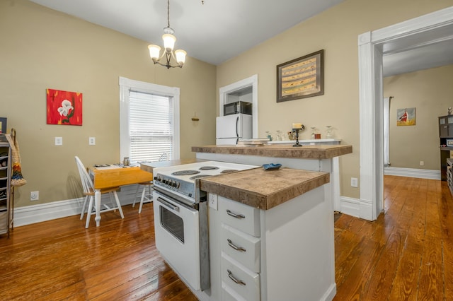 kitchen with baseboards, white cabinetry, white appliances, and dark wood finished floors
