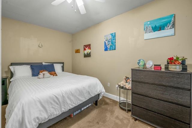 bedroom with ceiling fan, carpet flooring, and baseboards