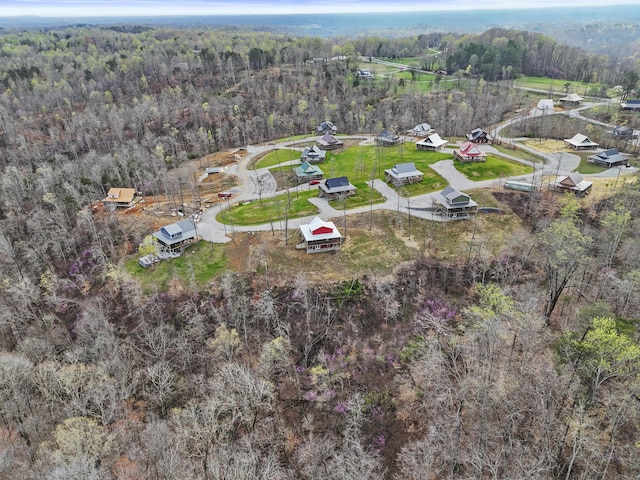 aerial view featuring a wooded view