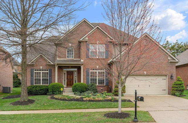 traditional-style home featuring concrete driveway, a front yard, brick siding, and cooling unit