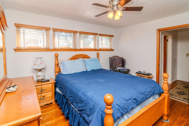 bedroom featuring a ceiling fan and light wood finished floors